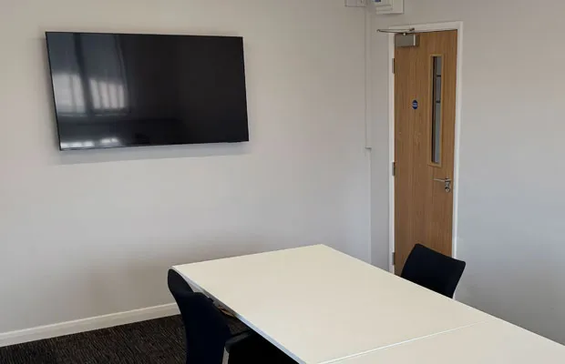 Meeting room with wall-mounted screen